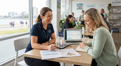 A registered nutritionist discussing dietary planning documents with a client at an open consultation table in Geelong.